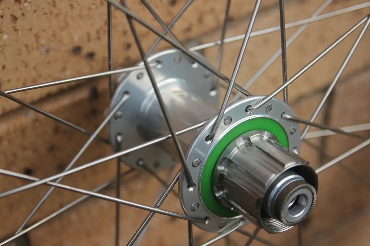 Close-up of the silver Hope rear hub and its green freehub seal