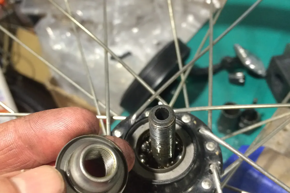 A hub stripped down during a service, with the freehub body and bearings removed